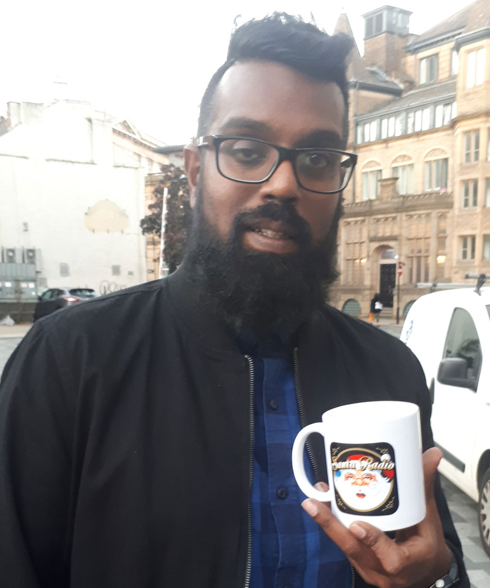 Romesh Ranganathan with Santa Radio mug