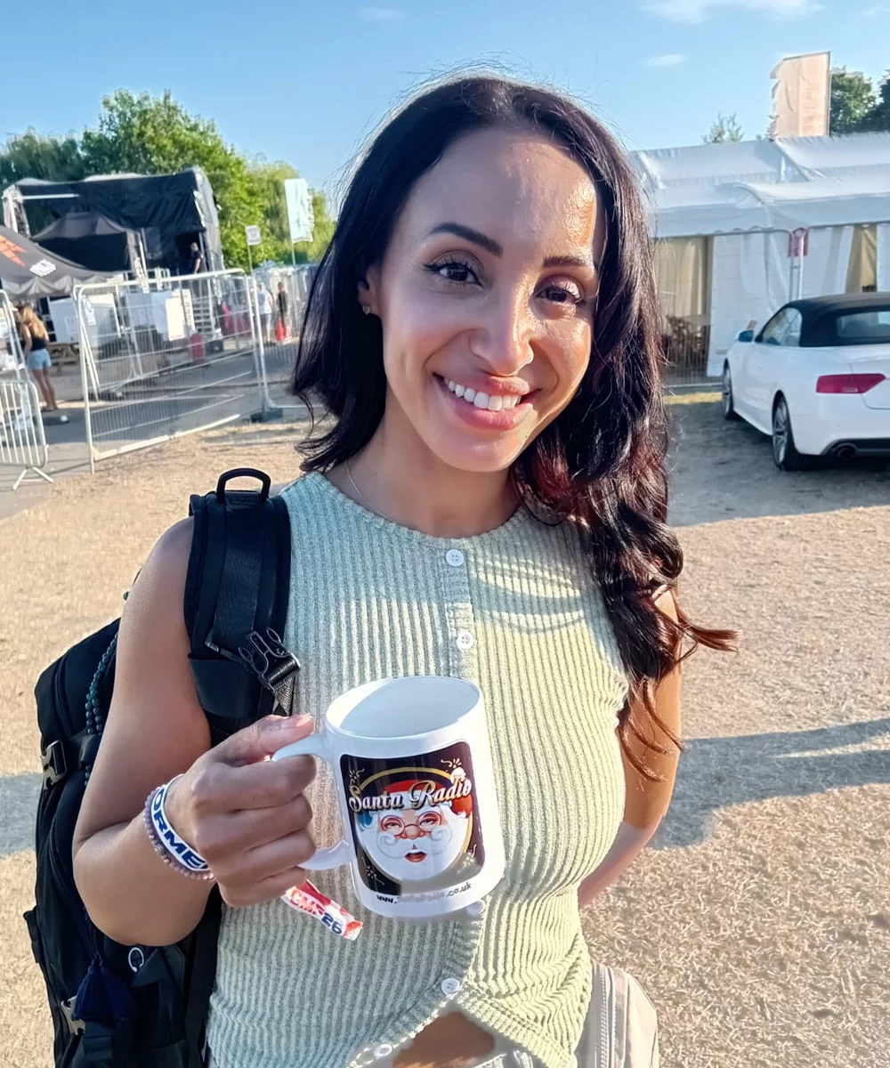 Amelle Berrabah with Santa Radio mug