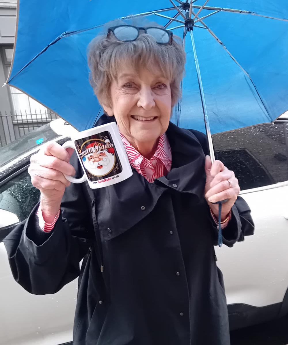 Deidre Sanders with Santa Radio mug
